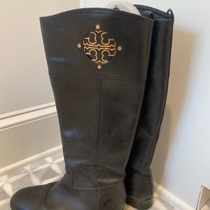 Black Tory Burch riding boots.